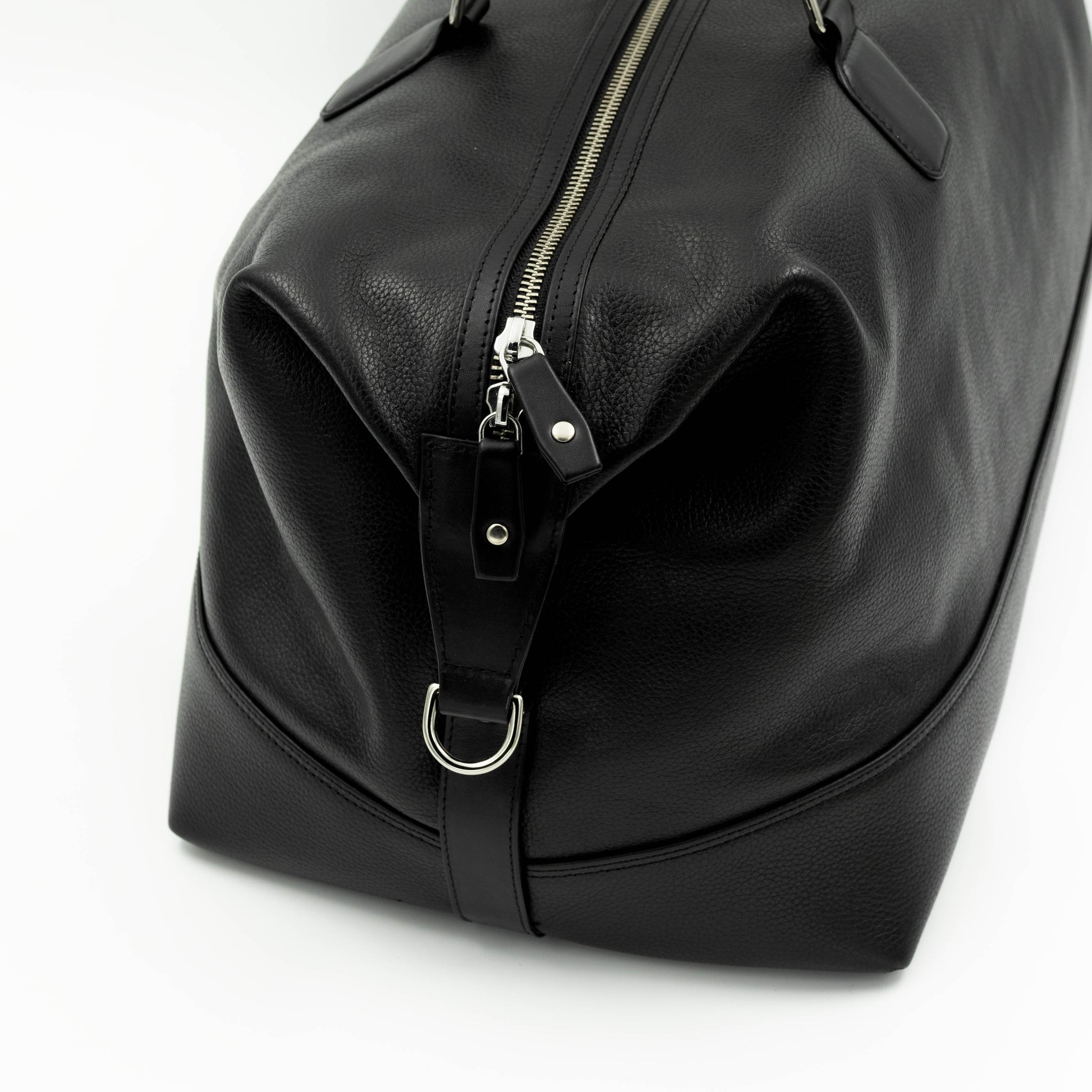 The side of the bag has a D Ring for shoulder strap attachment.