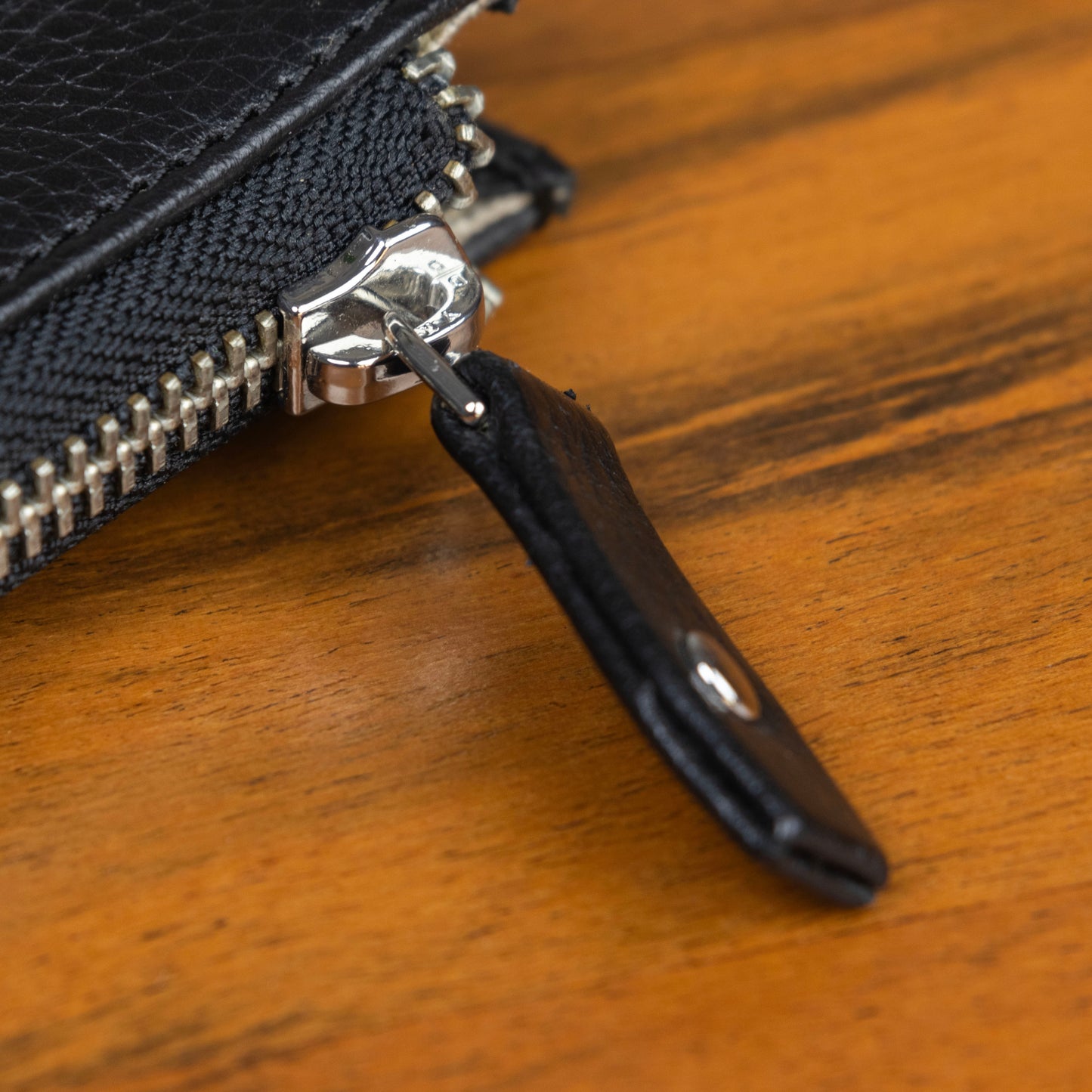 The YKK zippers have leather pull tabs fastened with rivets for added strength