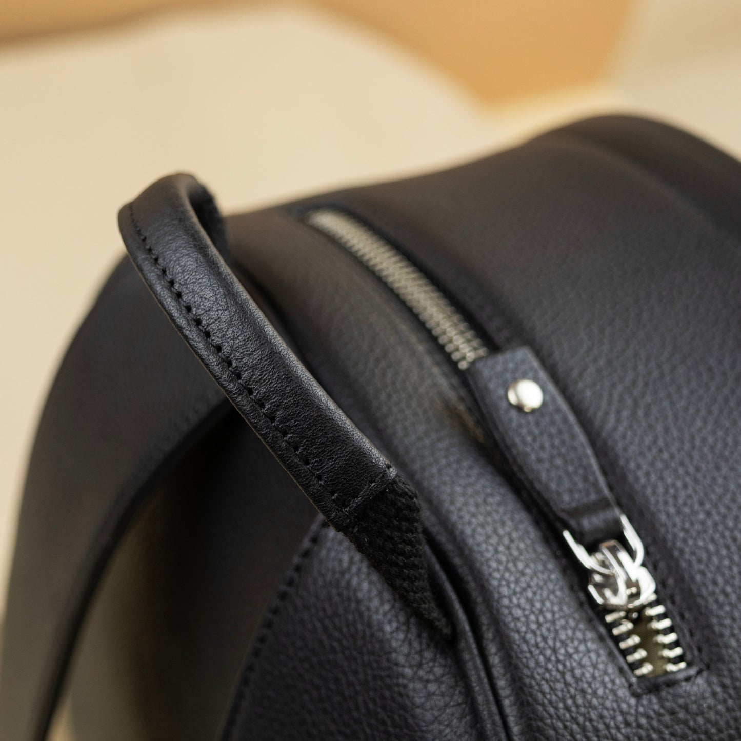 Leather Backpack with a top zip pocket for EDC items