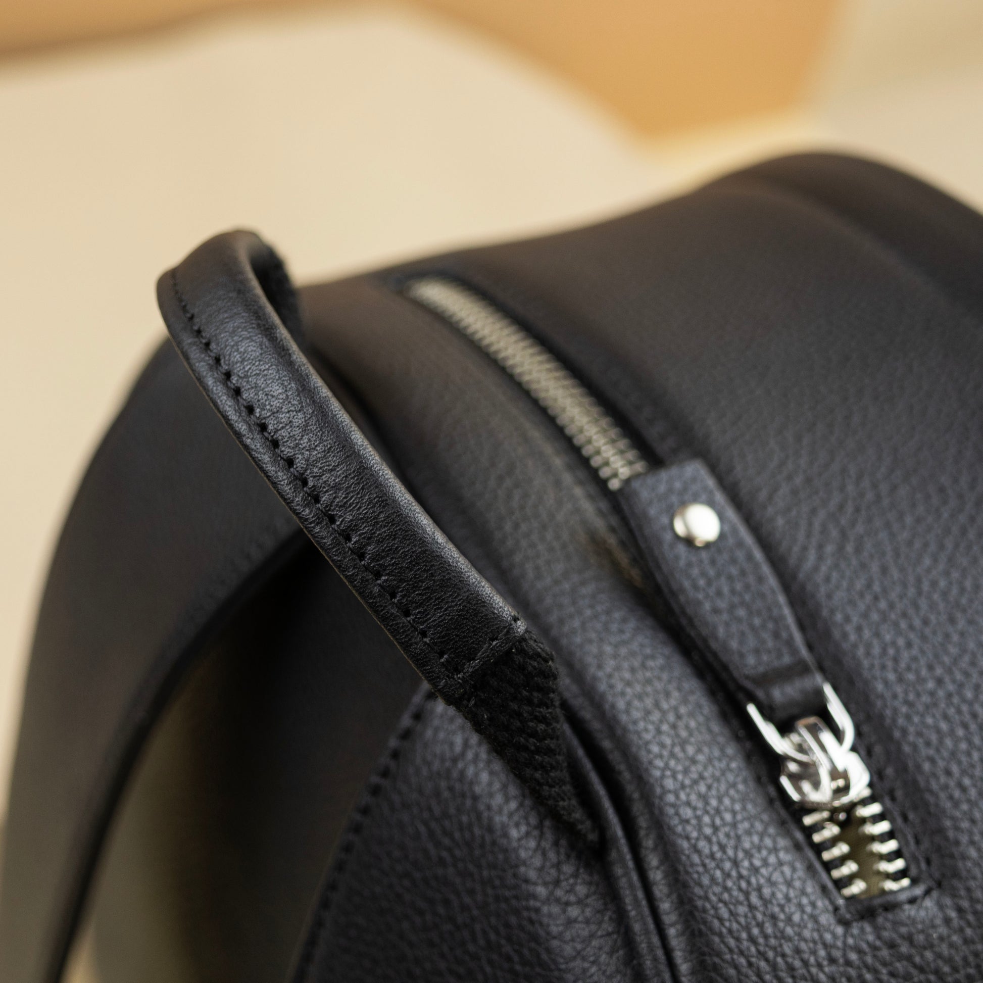 Leather Backpack with a top zip pocket for EDC items