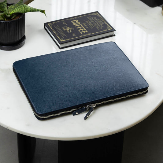 A handcrafted leather laptop case in blue