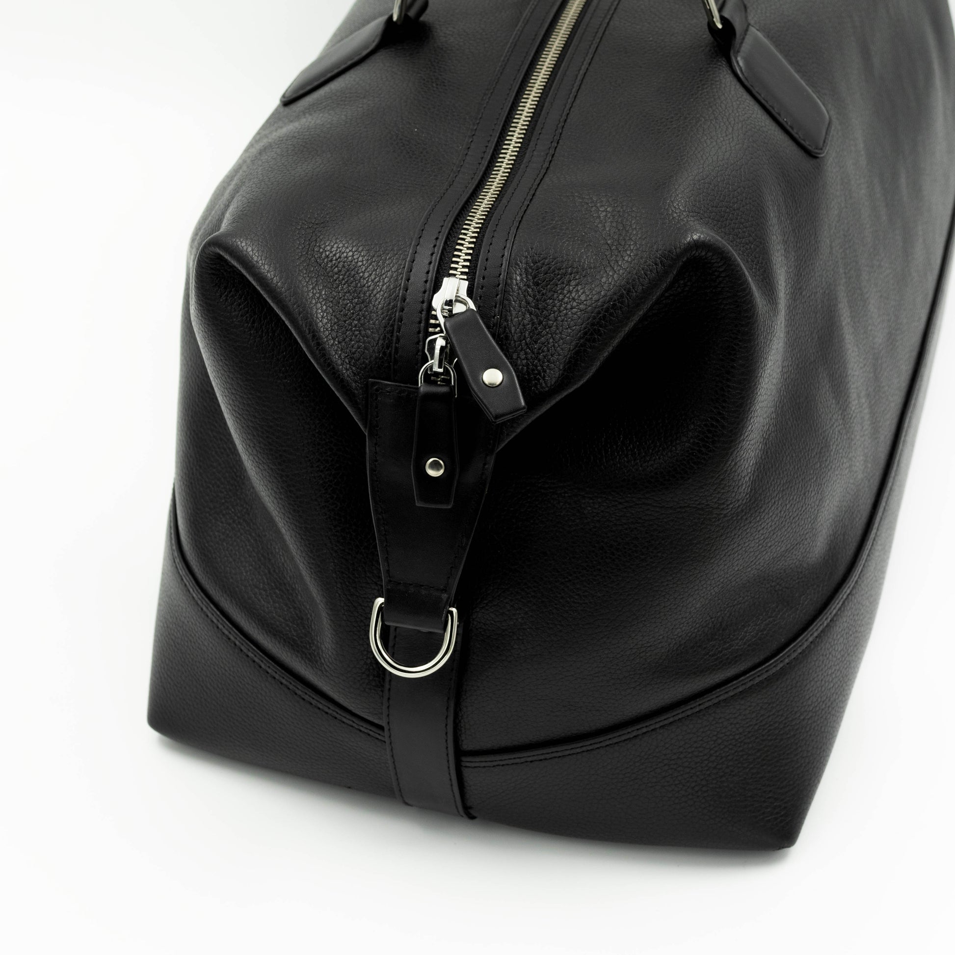 The side of the bag has a D Ring for shoulder strap attachment. 