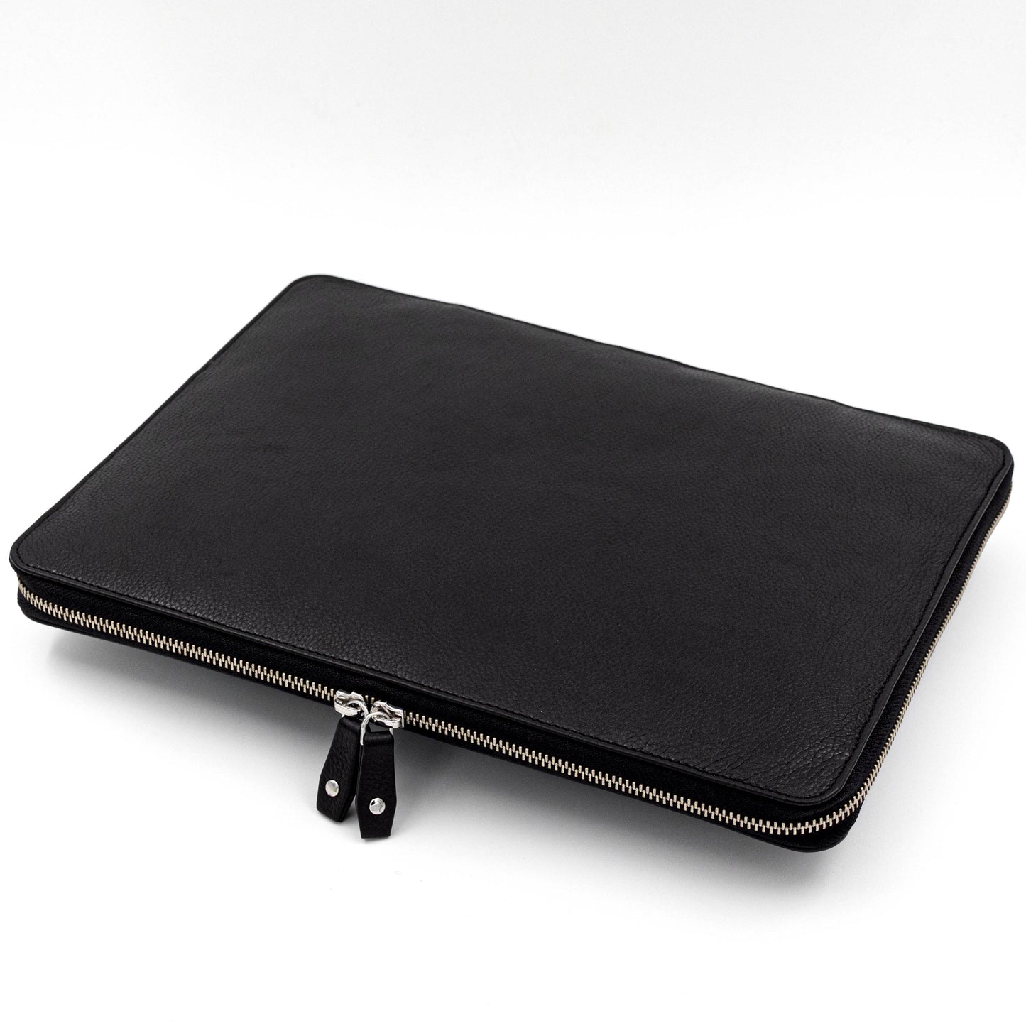 Leather case for surface pro in black. The leather is pebble grained in texture that makes it resistant to everyday wear and tear
