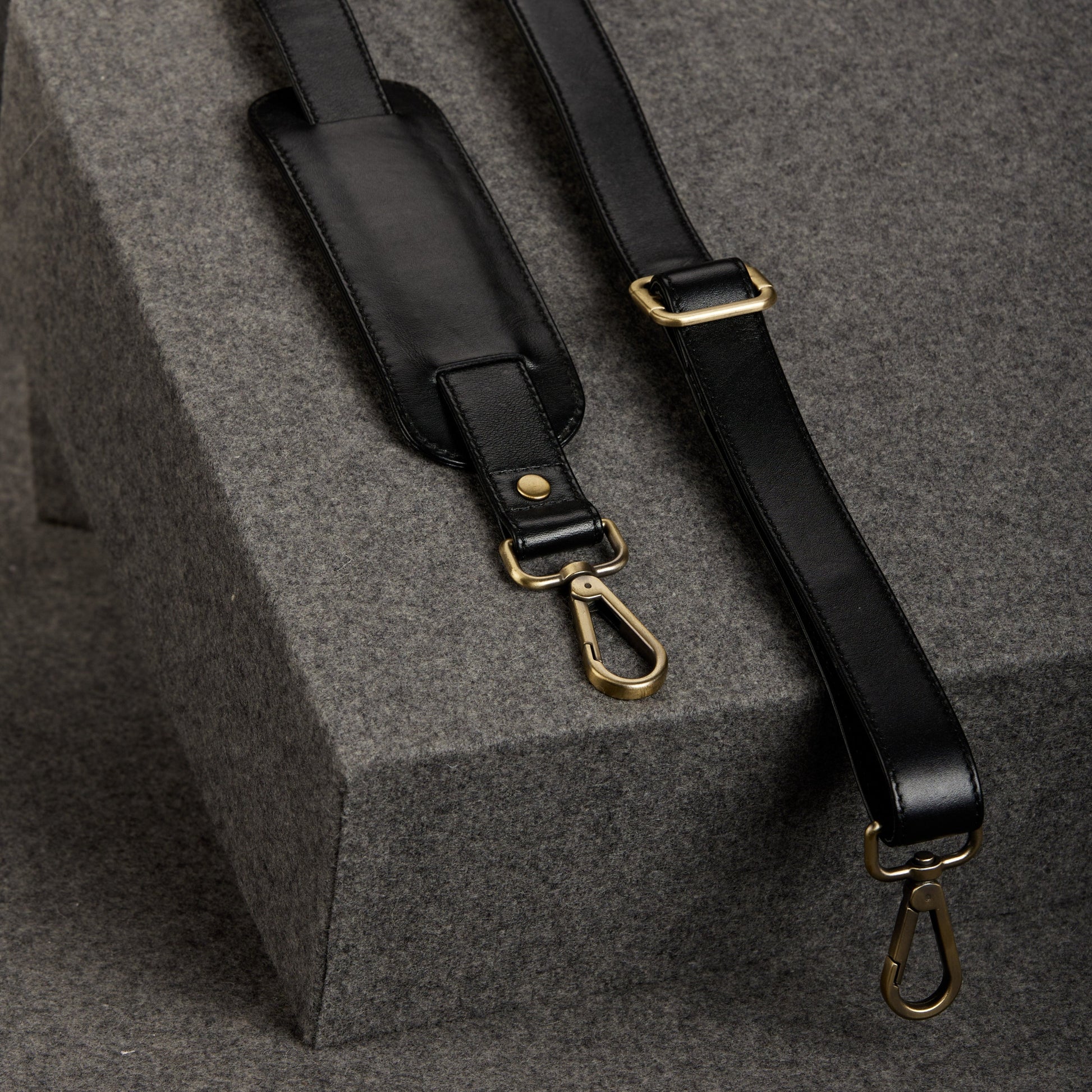 Leather shoulder strap that is adjustable and padded