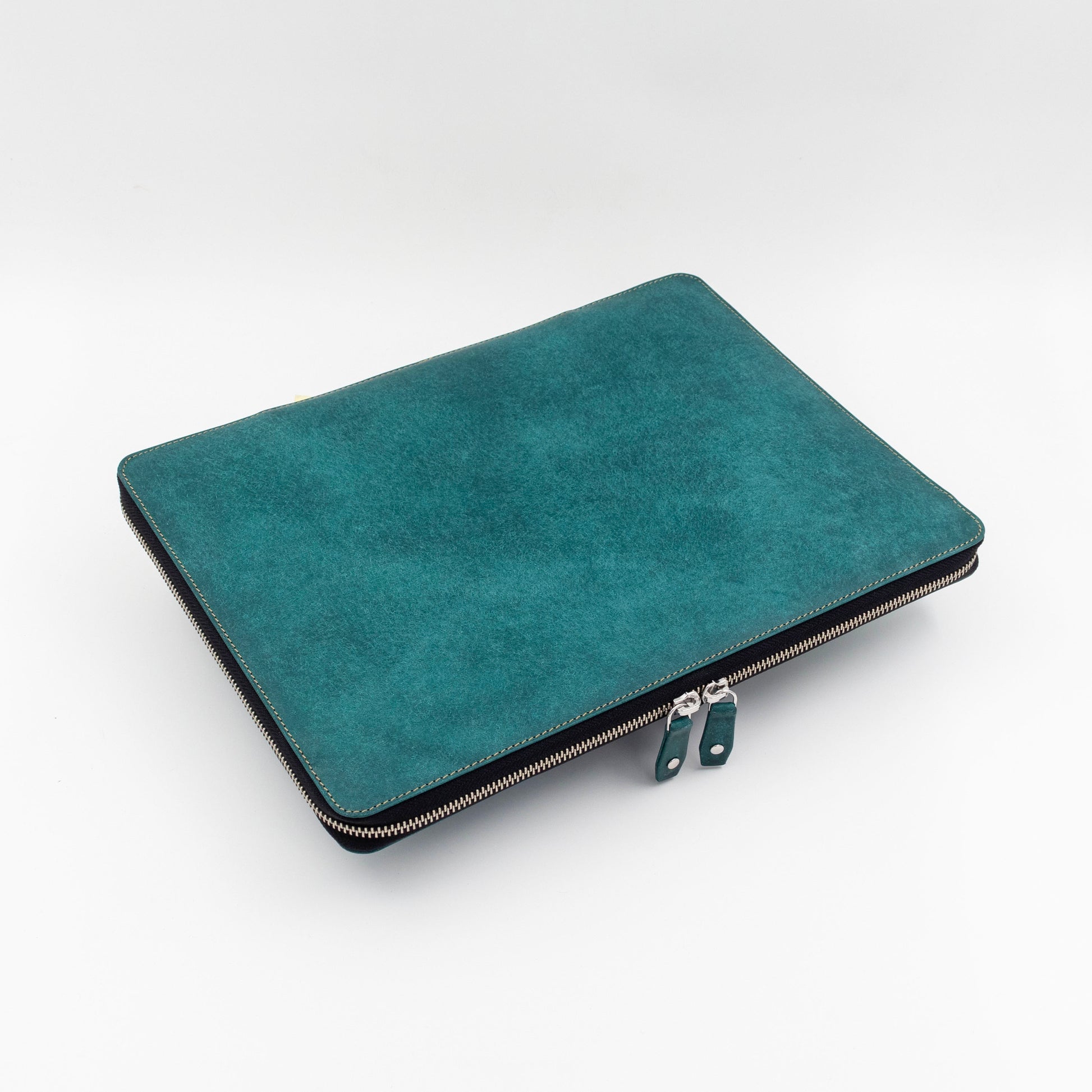 Handmade leather laptop case with a zip around closure. Designed to fit the surface pro device with a keyboard
